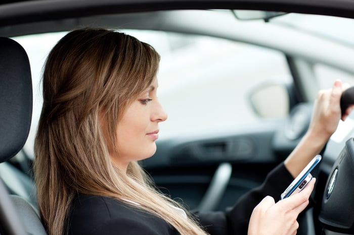 Work pressures might be propelling distracted driving rates